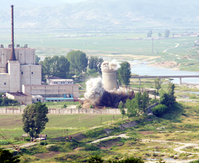 In this file photo,the cooling tower of the Yongbyon nuclear complex is demolished in Yongbyon, North Korea in 2008. (Yonhap)