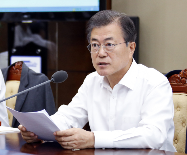 South Korean President Moon Jae-in presides over a meeting on Monday with his senior secretaries at the Presidential Blue House in Seoul, a day before the Kim-Trump summit in Singapore. Yonhap