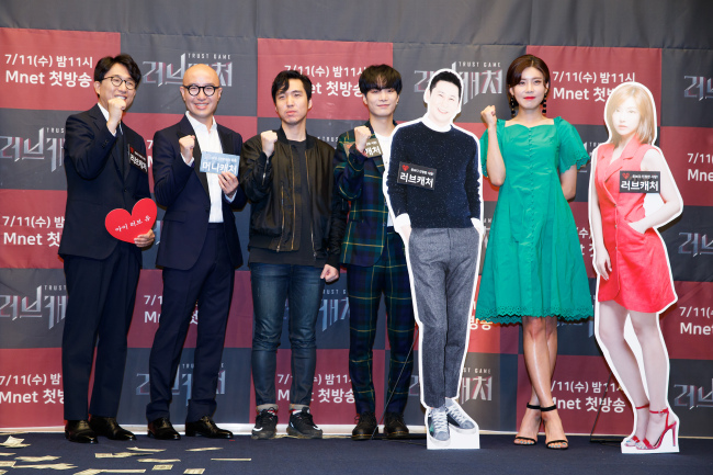Panelists of Mnet’s upcoming reality show “Love Catcher” pose during a press conference in Seoul on Monday. (Mnet)