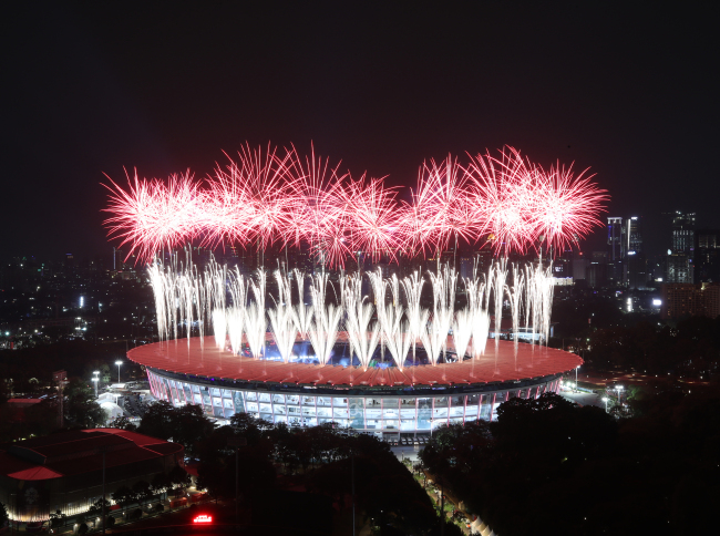 Fireworks explode over the Gelora Bung Karno main stadium during the opening ceremony of the 2018 Asian Games in Jakarta on Saturday. (AFP-Yonhap)