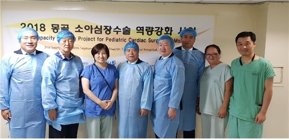 Korean medical professionals pose for a photo in Mongolia, where they have performed some 60 free heart surgery operations for local children over the past six years. Rotary Korea