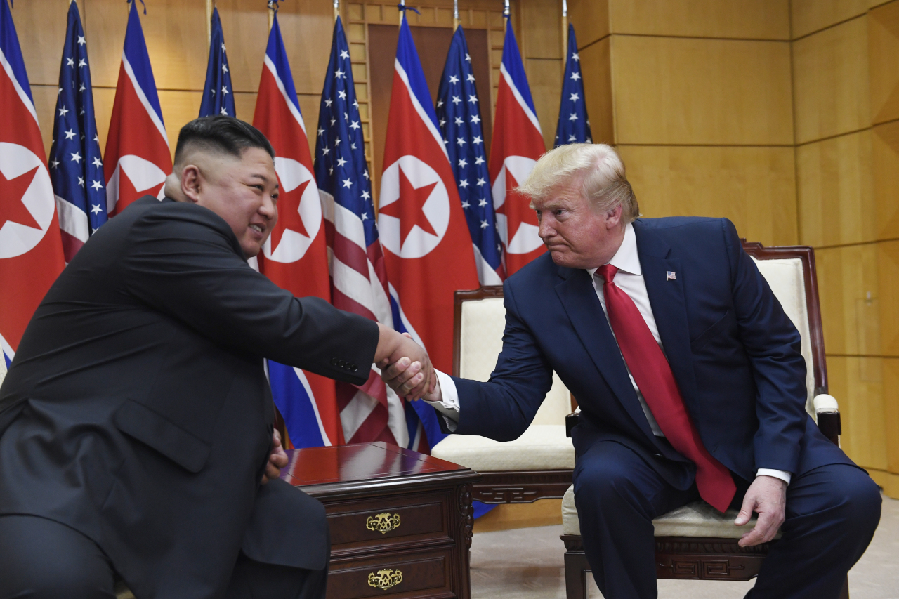 US President Donald Trump meets with North Korean leader Kim Jong-un at the border village of Panmunjom in the Demilitarized Zone, South Korea, Sunday.