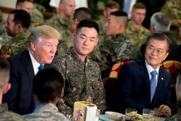 South Korean President Moon Jae-in and US President Donald Trump have lunch with US and South Korean tropps at Camp Humphreys in Pyeongtaek, South Korea. (AP-Yonhap)