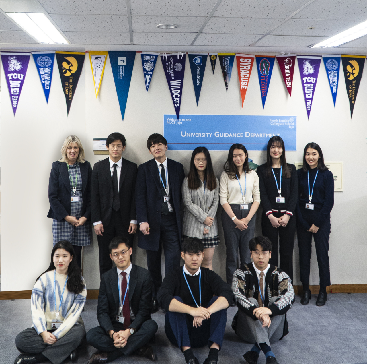 Students who were accepted into Oxford University or Cambridge University this year, from North London Collegiate School Jeju, pose for a photo with Lynne Oldfield (first from left, back row), principal of the school. (NLCS Jeju)
