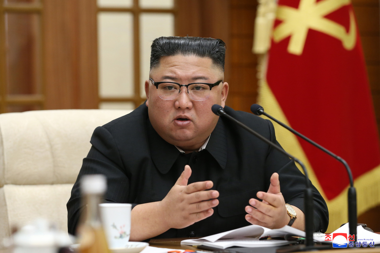 North Korean leader Kim Jong-un speaks during a politburo meeting on Sunday. (KCNA-Yonhap)