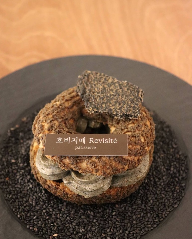Owner-chef Lee Seung-jun uses black sesame seeds to create the rich mousseline filling for his take on the Paris-Brest. (Revisite)