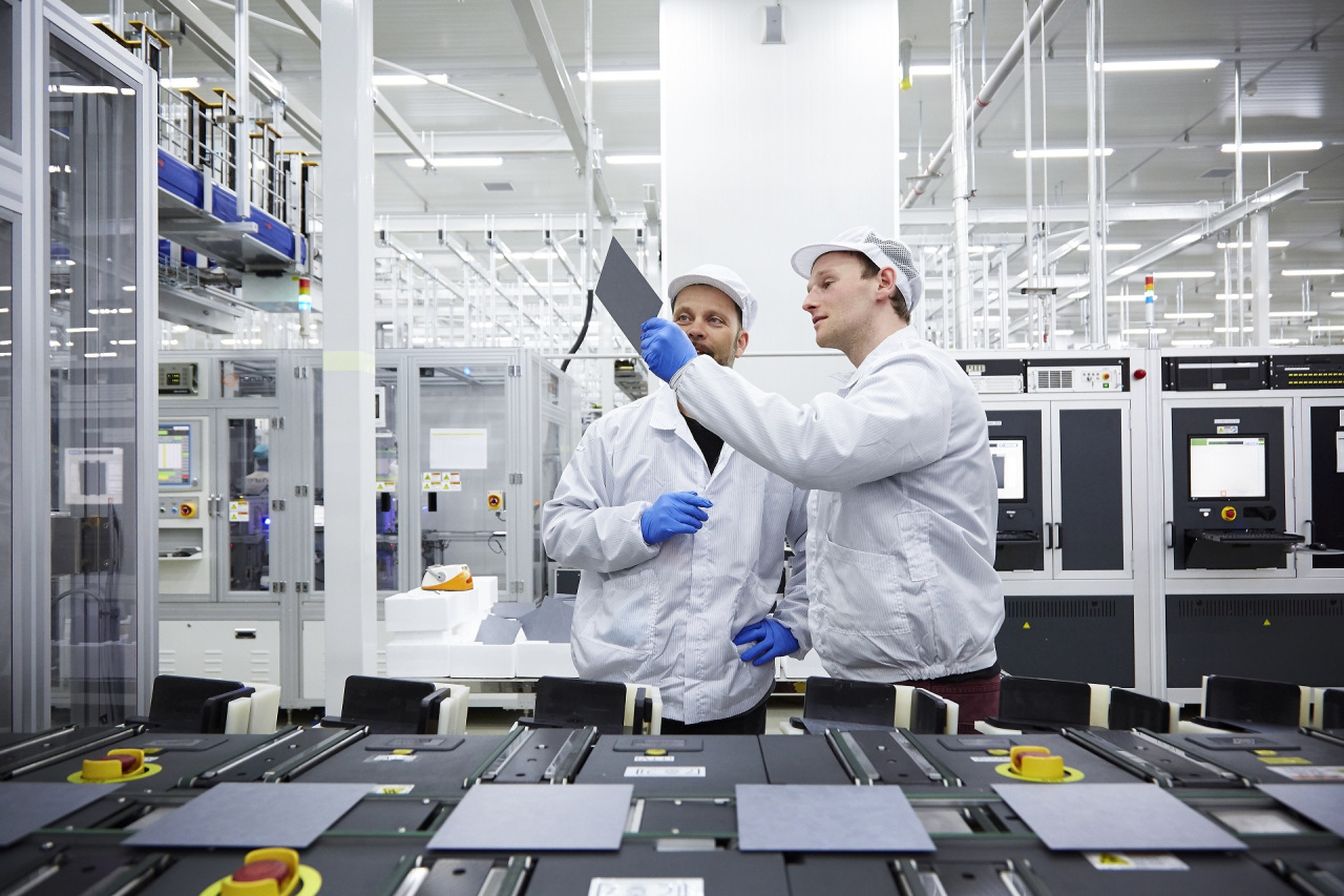 Hanwha Q Cells officials check the quality of solar cells. (Hanwha Q Cells)