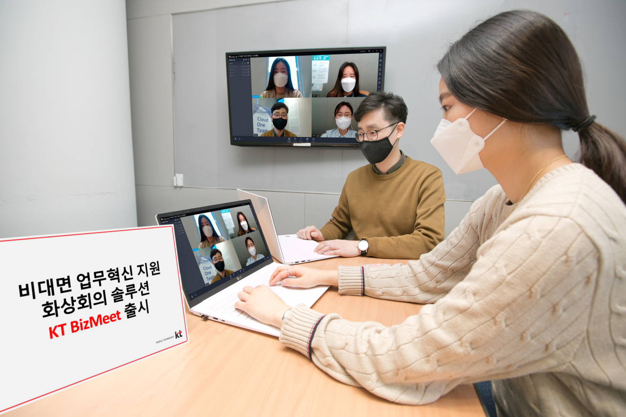 This photo, provided by KT Corp. last Friday, shows the company's workers using its new video conference platform. (KT Corp.)