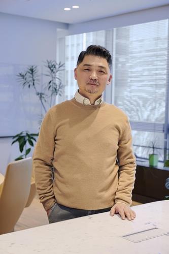 This undated image, provided by South Korea's top mobile messenger operator Kakao Corp., shows the company's founder, Kim Beom-su. (Kakao Corp.)