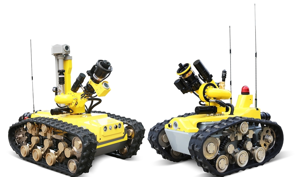 This photo, provided by Doosan Corp. on Monday, shows two firefighting robots produced by Chinese robot maker CITIC HIC Kaicheng Intelligence Equipment Co. (Doosan Corp.)