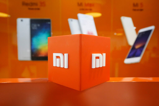 The logo of Xiaomi is seen inside the company's office in Bengaluru, India in 2018. (Reuters-Yonhap)