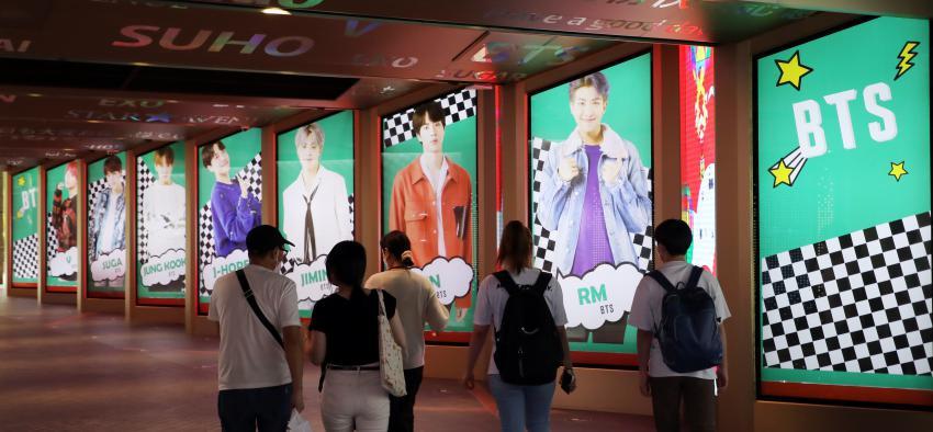 Digital billboard ads featuring BTS are on display outside a department store in Seoul. (Yonhap)