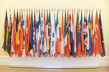 Flags of each of the members of the Organization for Economic Cooperation and Development are seen at its headquarters in Paris. (OECD)