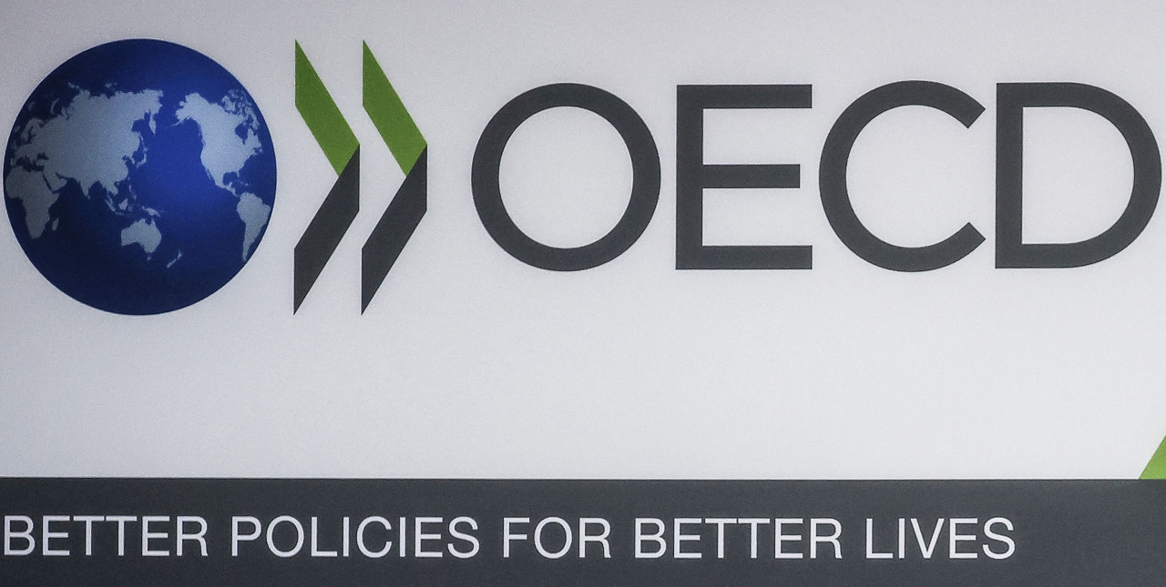 The Organization for Economic Cooperation and Development logo is seen at the 60th OECD Ministerial Council Meeting in Paris on Wednesday. The OECD said Friday that 136 countries had agreed to impose a global minimum tax rate on corporations of 15 percent following years of negotiations on far-reaching reform. “This is a major victory for effective and balanced multilateralism,” said OECD Secretary-General Mathias Cormann in a statement after Ireland, Hungary and Estonia joined the deal, leaving Pakistan, Nigeria, Kenya and Sri Lanka as the only holdouts. (AFP-Yonhap)