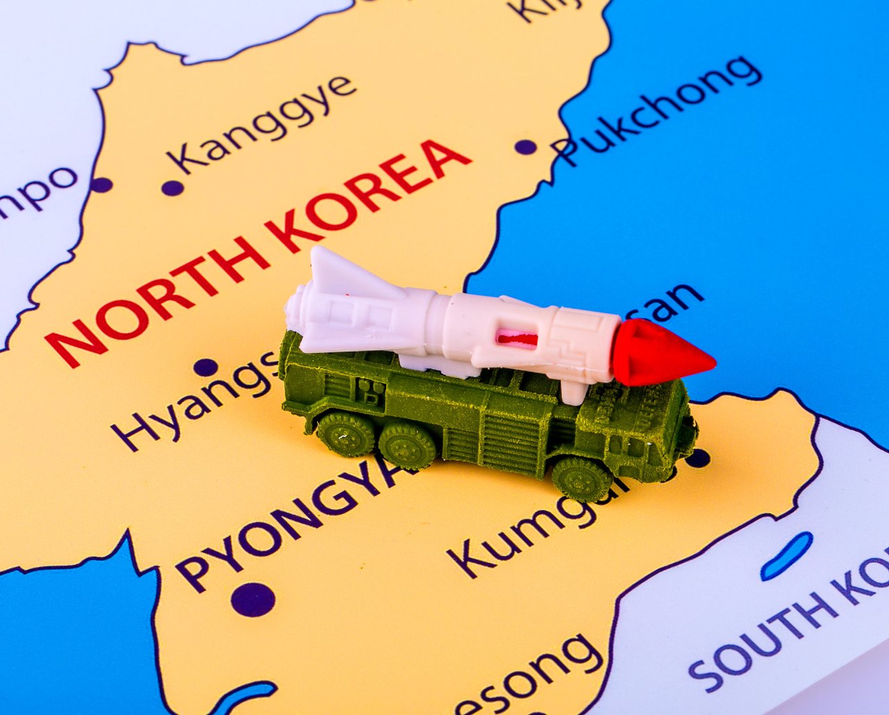 Map of North Korea with a figure of a missile on a transporter erector launcher (123rf)