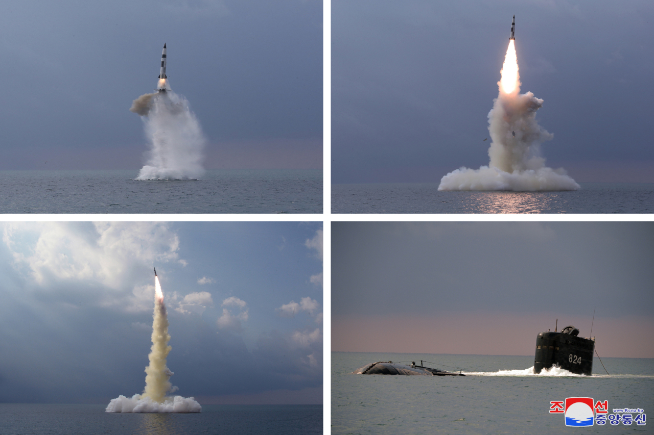 This combined photo, released Korean Central News Agency on Wednesday, shows a SLBM being fired in waters off the east coast the previous day. (KCNA-Yonhap)