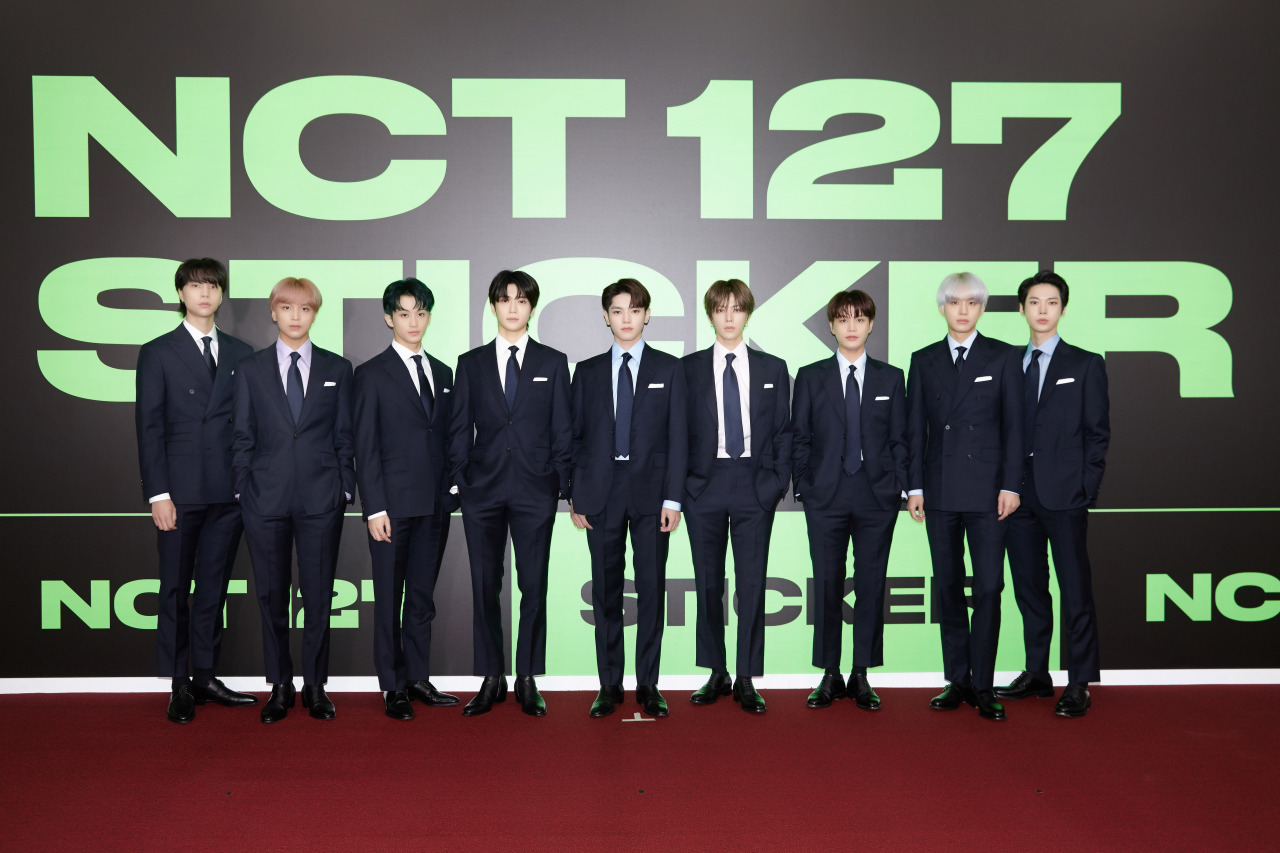 NCT 127 poses at the “Sticker” media showcase in September. (S.M. Entertainment)