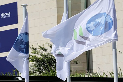 Flags of the Organization for Economic Cooperation and Development at its headquarters in Paris (OECD)