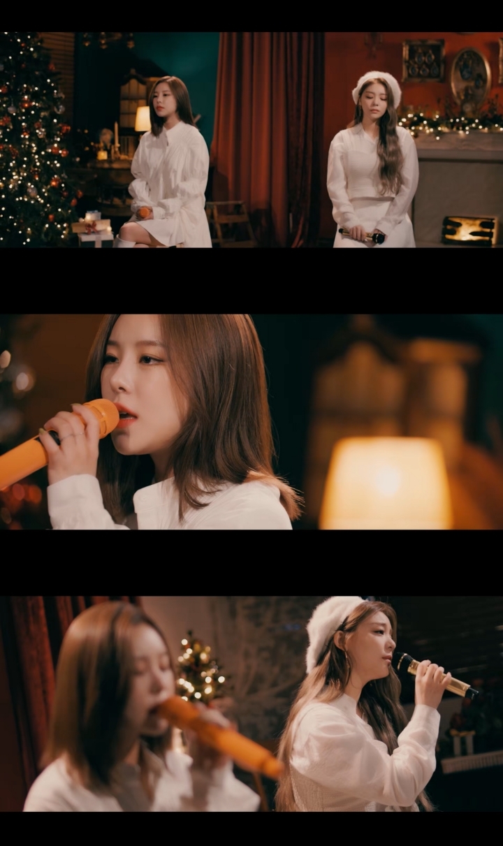 Video footage of Mamamoo’s Wheein (top left) and Ailee singing “Solo Christmas” (The L1ve)