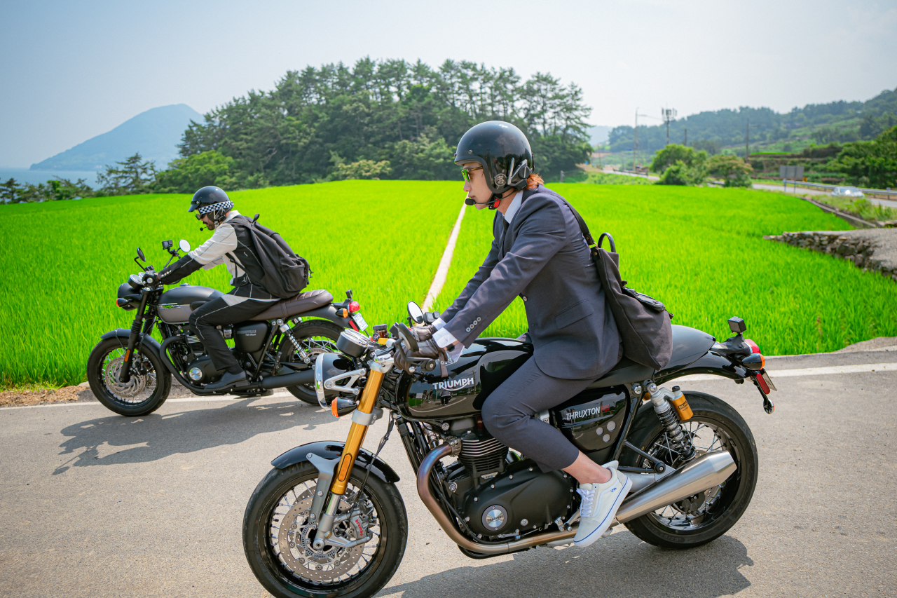 Rain (right) and Ro Hong-chul travel around the country on their motorcycles in “The Hungry and the Hairy” (Netflix)