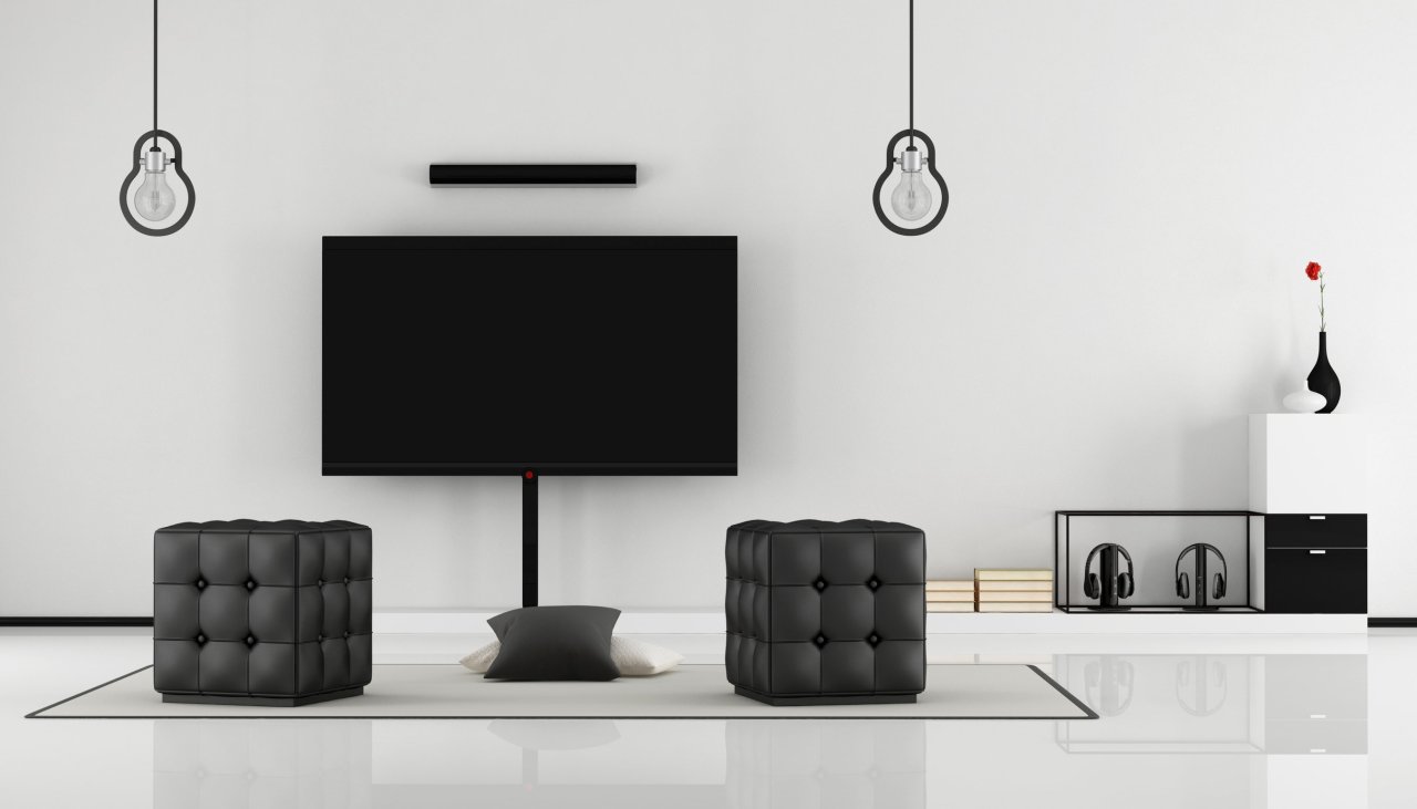 A minimalist black and white lounge with a TV set (123rf)