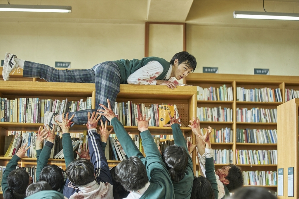 A scene from “All of Us Are Dead,“ where the title character Cheong-san played by actor Yoon Chan-young fights against zombies. (Netflix)