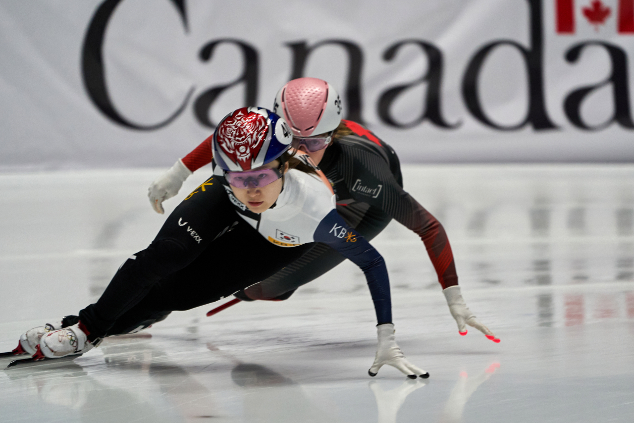 In this Canadian Press photo via the Associated Press, Choi Min-jeong of South Korea (L) and Kim Boutin of Canada compete in the women's 3,000m Superfinal at the International Skating Union World Short Track Speed Skating Championships at Maurice Richard Arena in Montreal on Sunday. (AP)