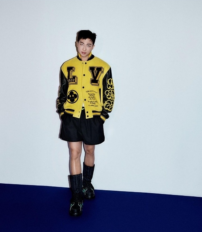 BTS’ RM is dressed in a yellow varsity jacket. (Louis Vuitton‘s Instagram)