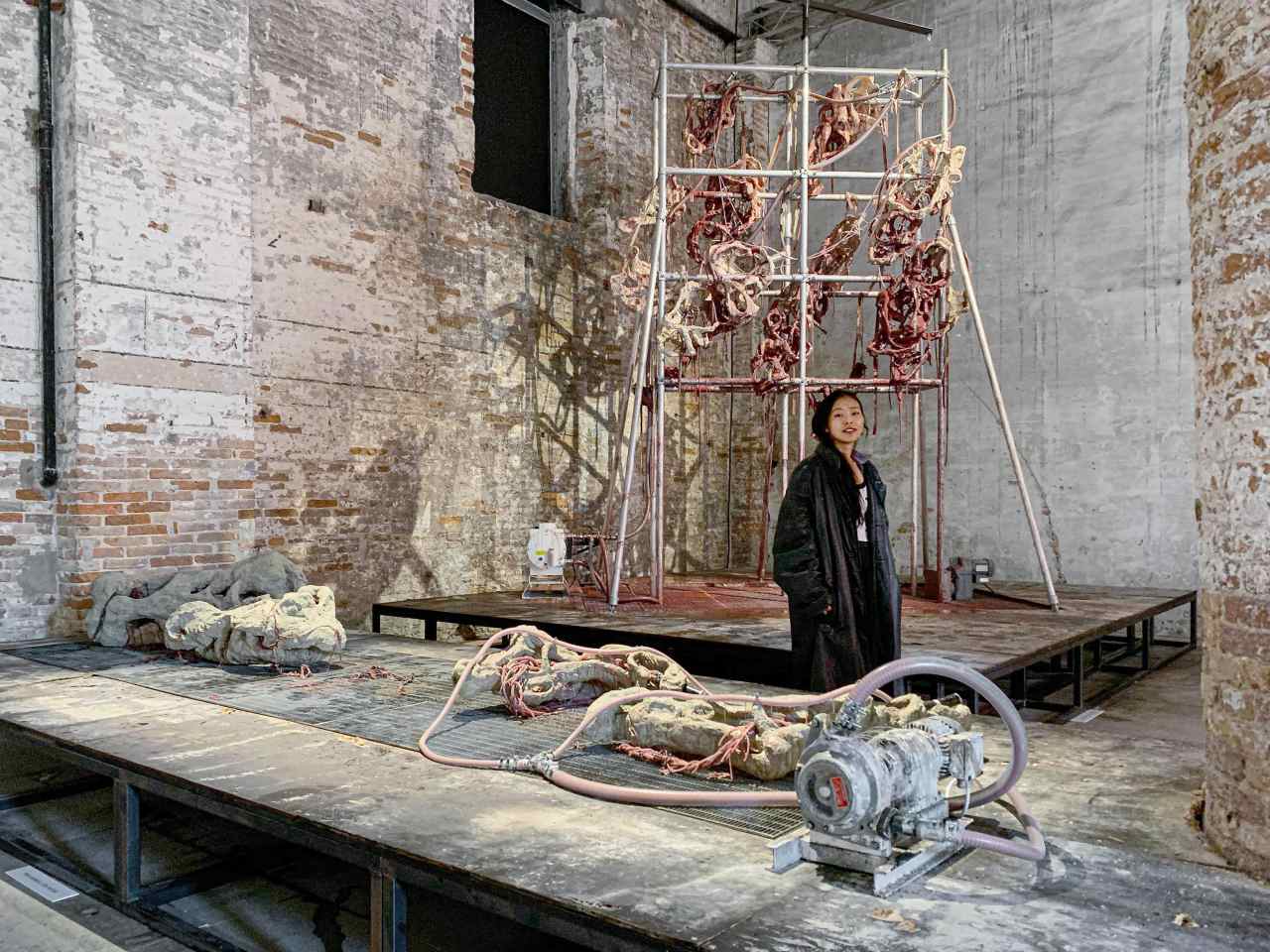 Lee Mi-re stands in front of her work, “Endless House: Holes and Drips,” at the Arsenale, the main exhibition venue of the Venice Biennale 2022. (Tina Kim Gallery)