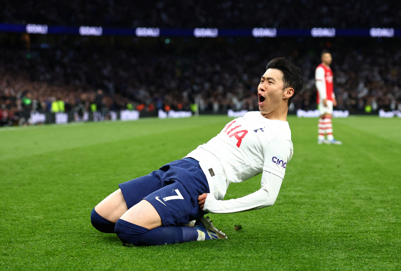 In this Reuters photo, Son Heung-min of Tottenham Hotspur celebrates after scoring a goal against Arsenal during the clubs' Premier League match at Tottenham Hotspur Stadium in London on Thursday. (Reuters)