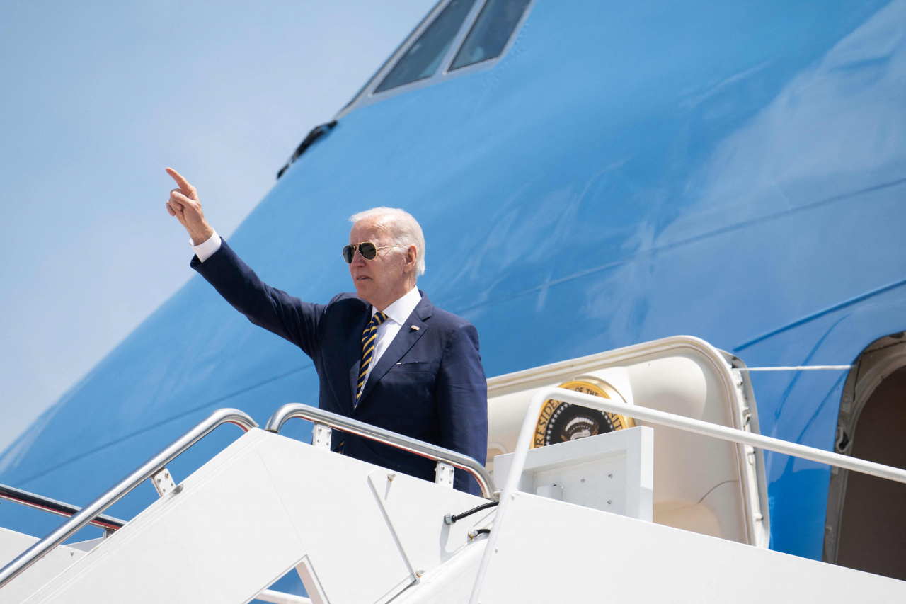US President Joe Biden boards Air Force One prior to departure from Joint Base Andrews in Maryland, Thursday, as he travels to South Korea and Japan, on his first trip to Asia as President. (AFP)