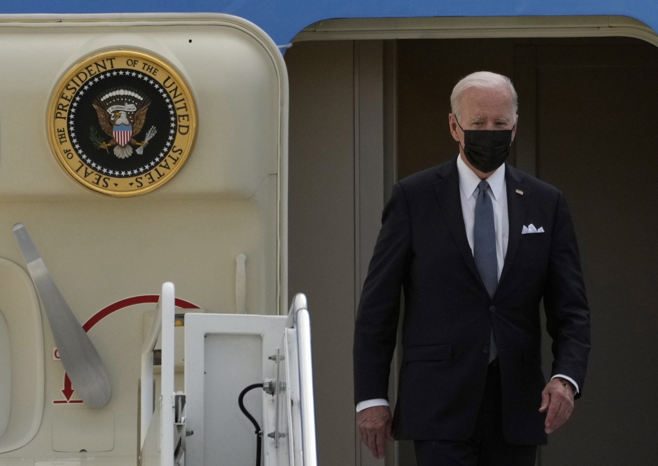 US President Joe Biden disembarks Air Force One upon landing at Yokota Air Base in Fussa, Tokyo suburbs, Japan, on Sunday. (EPA-Yonhap)