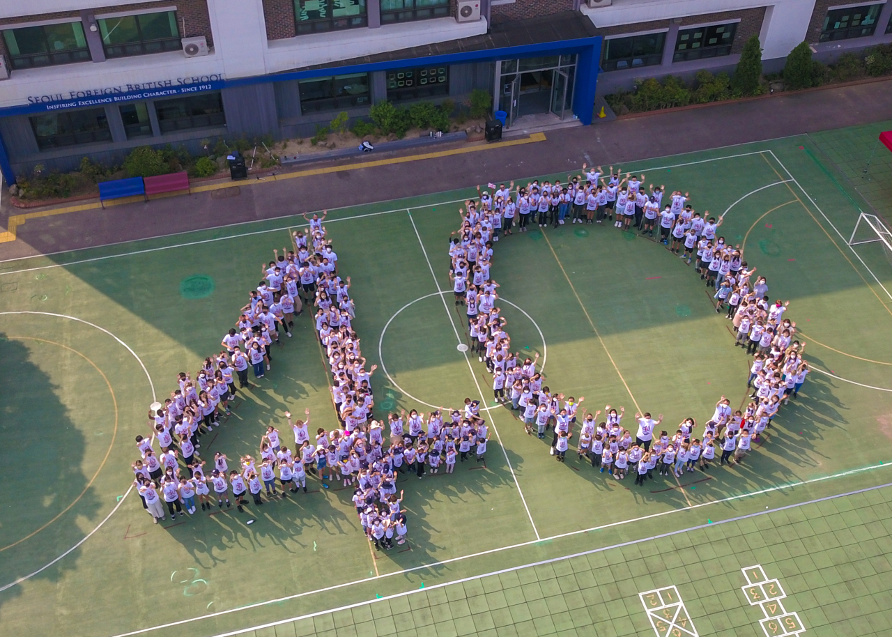 Students and staff form the number 40 to signify the 40th anniversary of British School at Seoul Foreign School. Seoul Foreign School