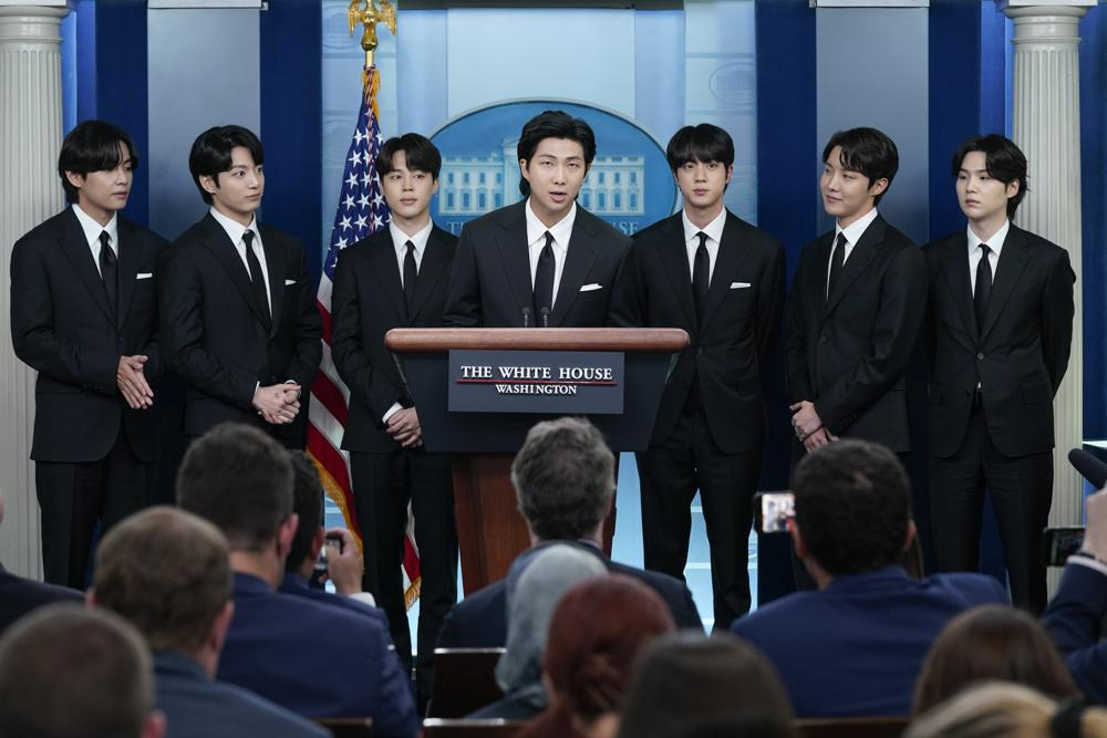RM, center, accompanied by other K-pop supergroup BTS members from left, V, Jungkook, Jimin, Jin, J-Hope, and Suga speaks during the daily briefing at the White House in Washington, on Tuesday. (AP)