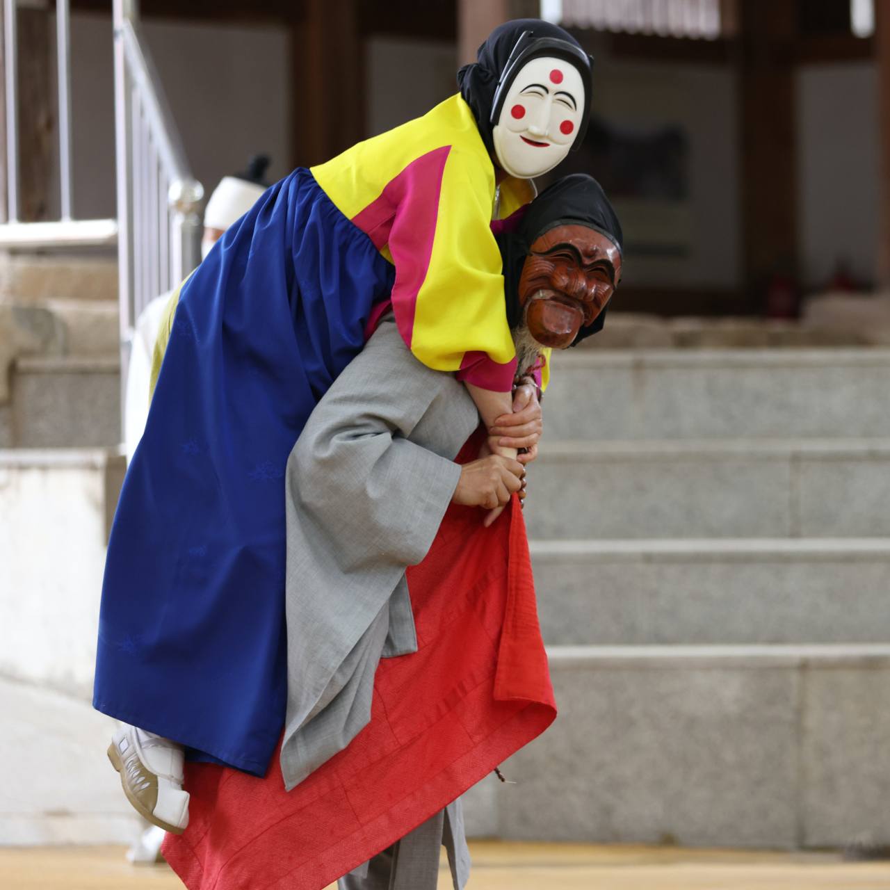 Monk and Bune masks are seen during a performance of the Hahoe Byeolsingut Talnori in Hahoe, Andong, North Gyeongsang Province. Photo © Hyungwon Kang
