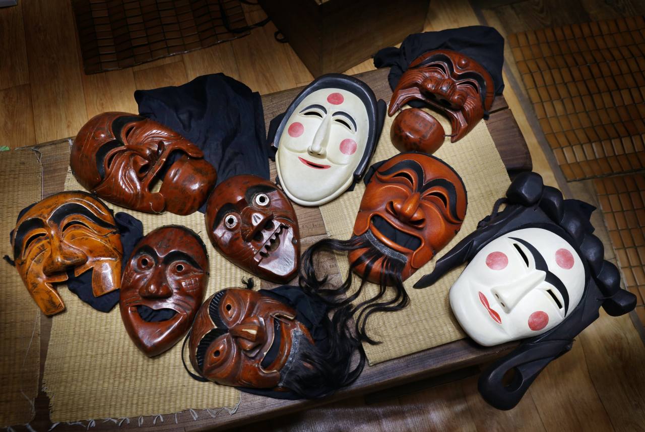 Hahoe Byeolsingut Talnori masks are displayed on a table in Hahoe, Andong, North Gyeongsang Province. Photo © Hyungwon Kang