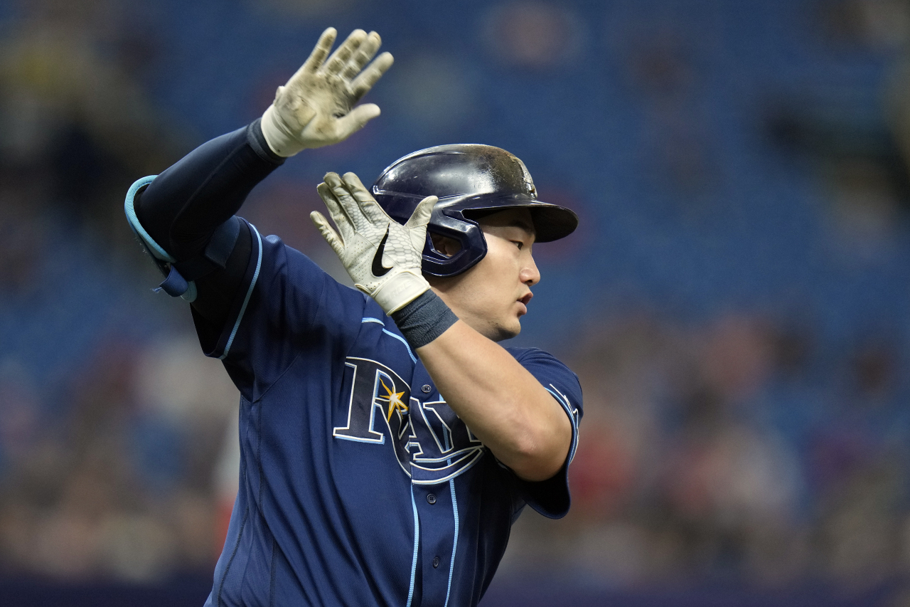 In this Associated Press photo, Choi Ji-man of the Tampa Bay Rays celebrates his two-run home run off St. Louis Cardinals pitcher Miles Mikolas during the bottom of the fourth inning of a Major League Baseball regular season game at Tropicana Field in St. Petersburg, Florida, on Thursday. (AP)