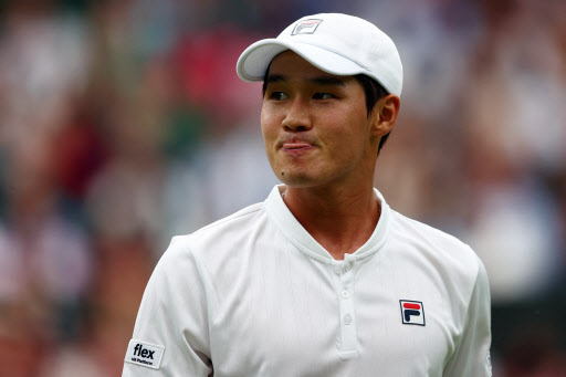 In this AFP photo, Kwon Soon-woo of South Korea reacts to a play against Novak Djokovic of Serbia during their men's singles first round match at Wimbledon at All England Club in London on Monday. (AFP)