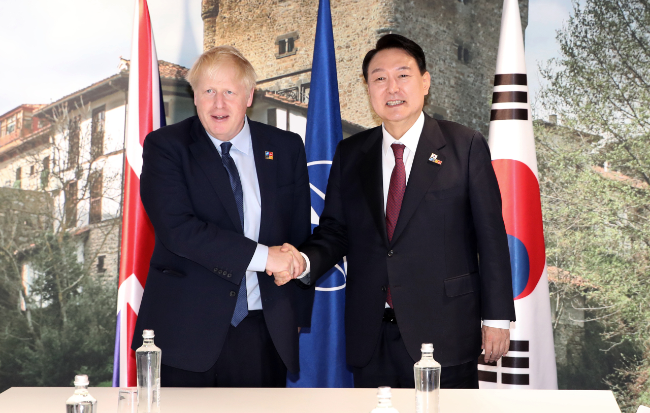 President Yoon Suk-yeol has a bilateral meeting with British Prime Minister Boris Johnson on the occasion of attending the NATO Summit on Thursday. (Yonhap)
