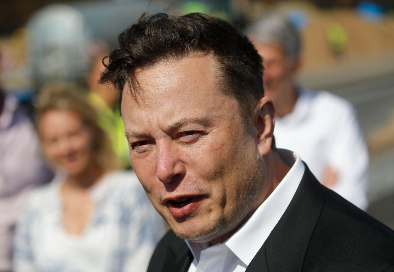 In this file photo taken on September 3, 2020 Tesla CEO Elon Musk talks to media as he arrives to visit the construction site of the future US electric car giant Tesla, in Gruenheide near Berlin. (AFP-Yonhap)