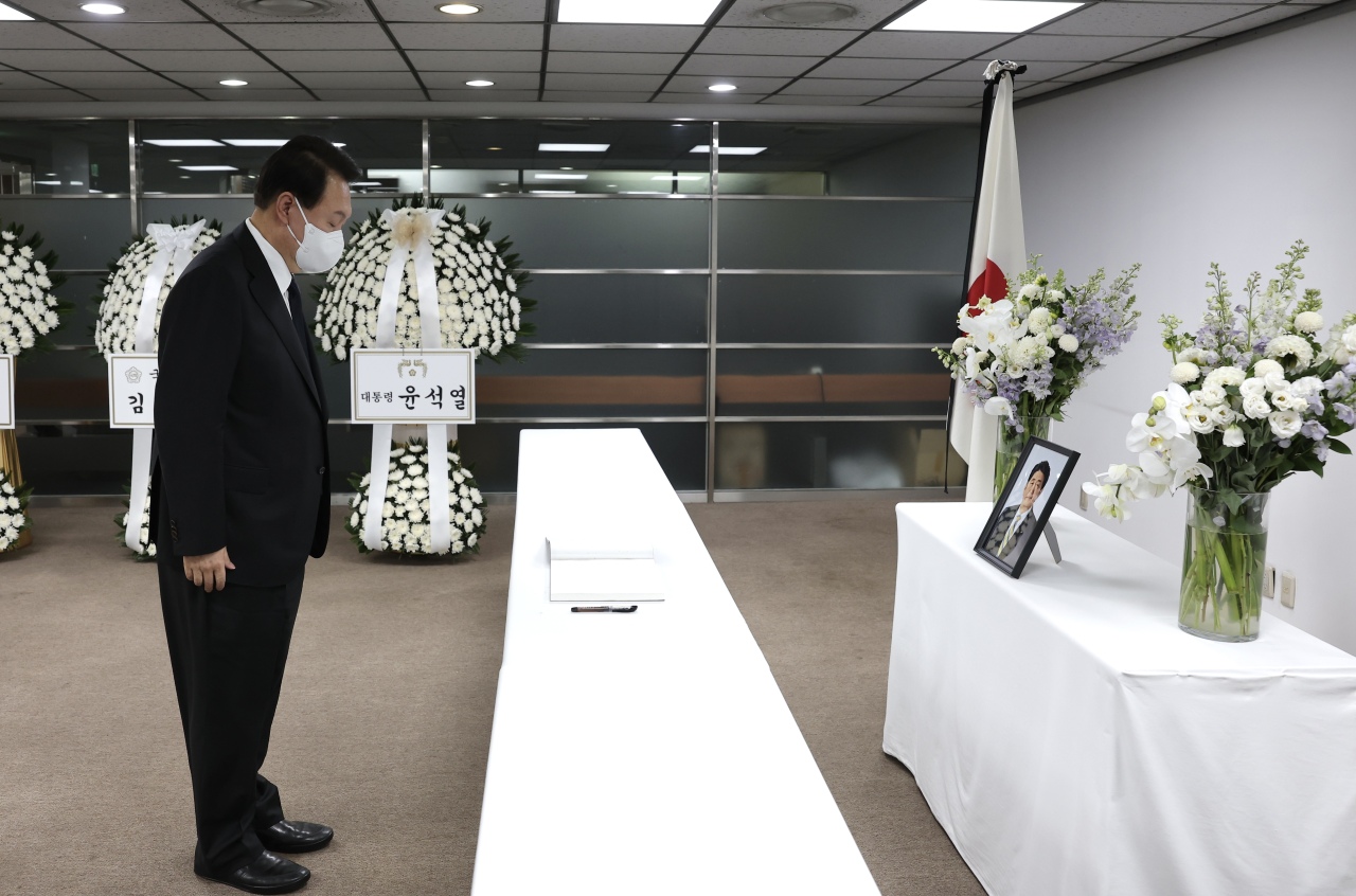 President Yoon Suk-yeol pays his respects to former Japanese Prime Minister Shinzo Abe at a memorial altar at the Japanese Embassy in Jongno, central Seoul, on Tuesday afternoon. (Yonhap)