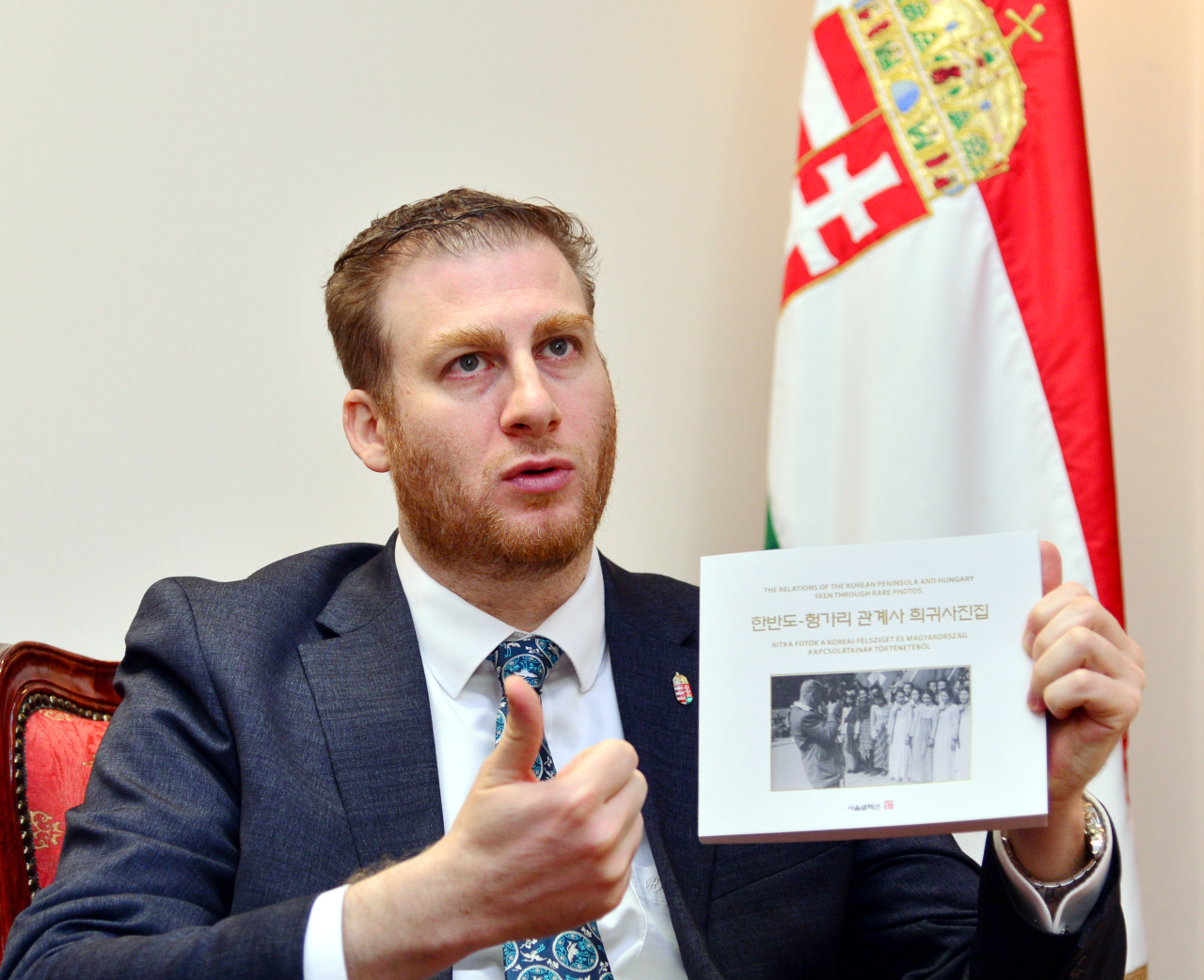 Hungarian Ambassador to Seoul Mozes Csoma introduces his photo book on Korea-Hungary historic ties in an interview with The Korea Herald at the embassy in central Seoul on Feb. 7. (Park Hyun-koo/ The Korea Herald)
