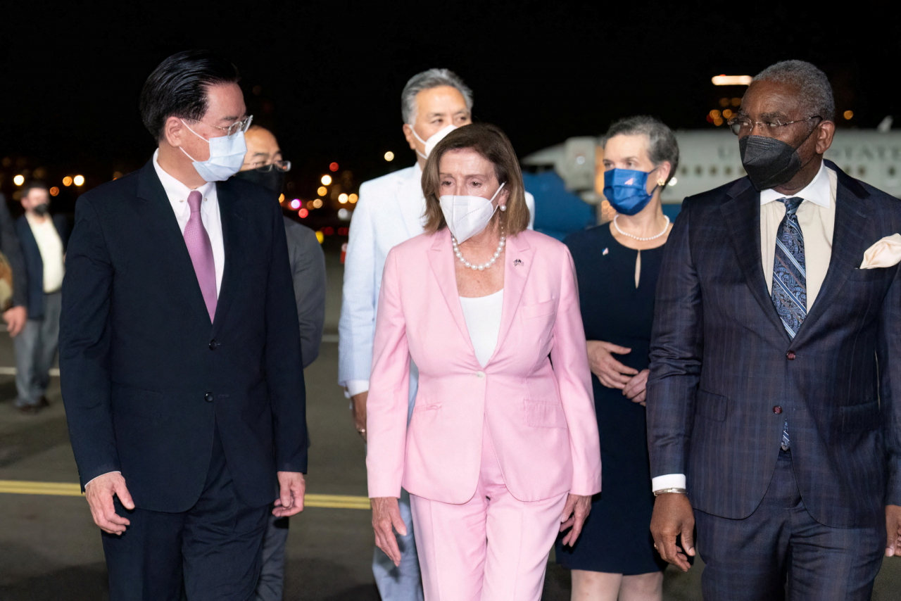 US House Speaker Nancy Pelosi (C) arrives at Taipei Songshan Airport on Tuesday, in this photo released by AFP. (AFP)