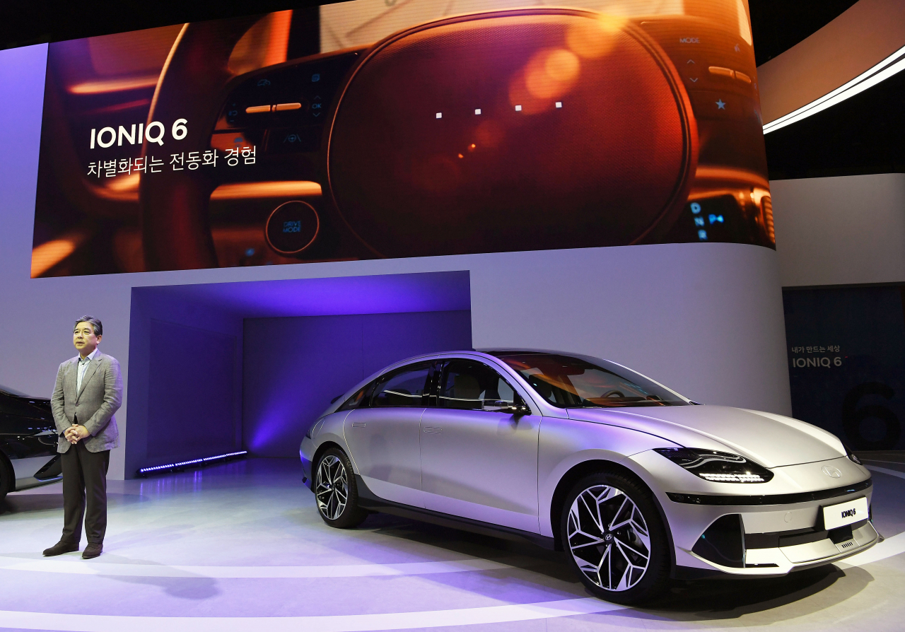The Ioniq 6, a new electric sedan of Hyundai Motor Co., is unveiled at the Busan International Motor Show 2022 at BEXCO in the country's largest port city on July 14. Hyundai and five other carmakers -- Kia, Genesis, BMW, MINI and Rolls Royce -- attended the event. (Yonhap)