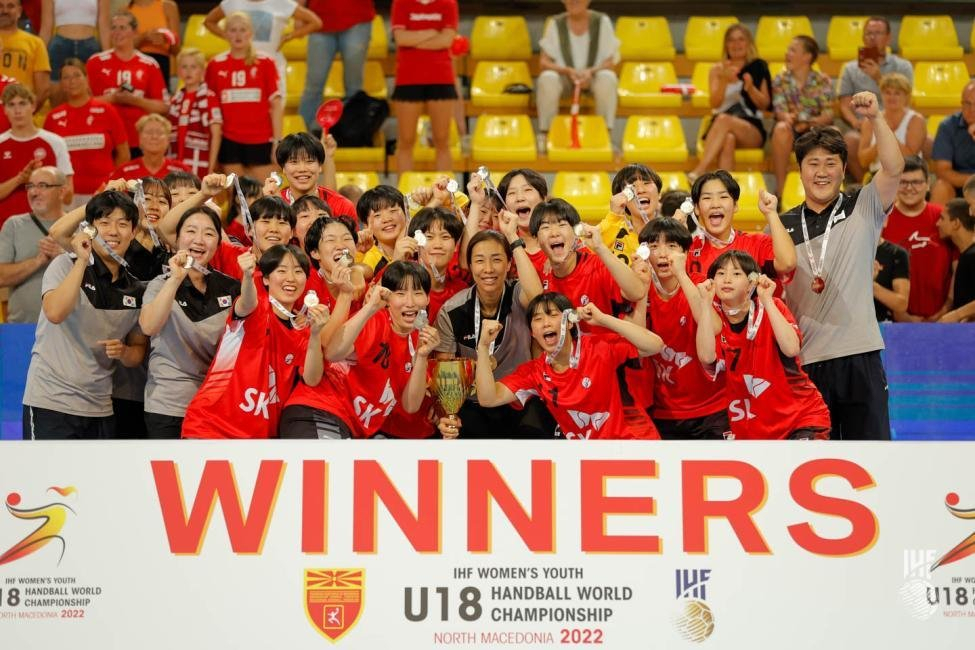 South Korean players and coaches celebrate their 31-28 victory over Denmark in the final of the International Handball Federation (IHF) Women's Youth World Championship at Boris Trajkovski Sports Center in Skopje, North Macedonia, on Wednesday, in this photo provided by the IHF. (IHF)
