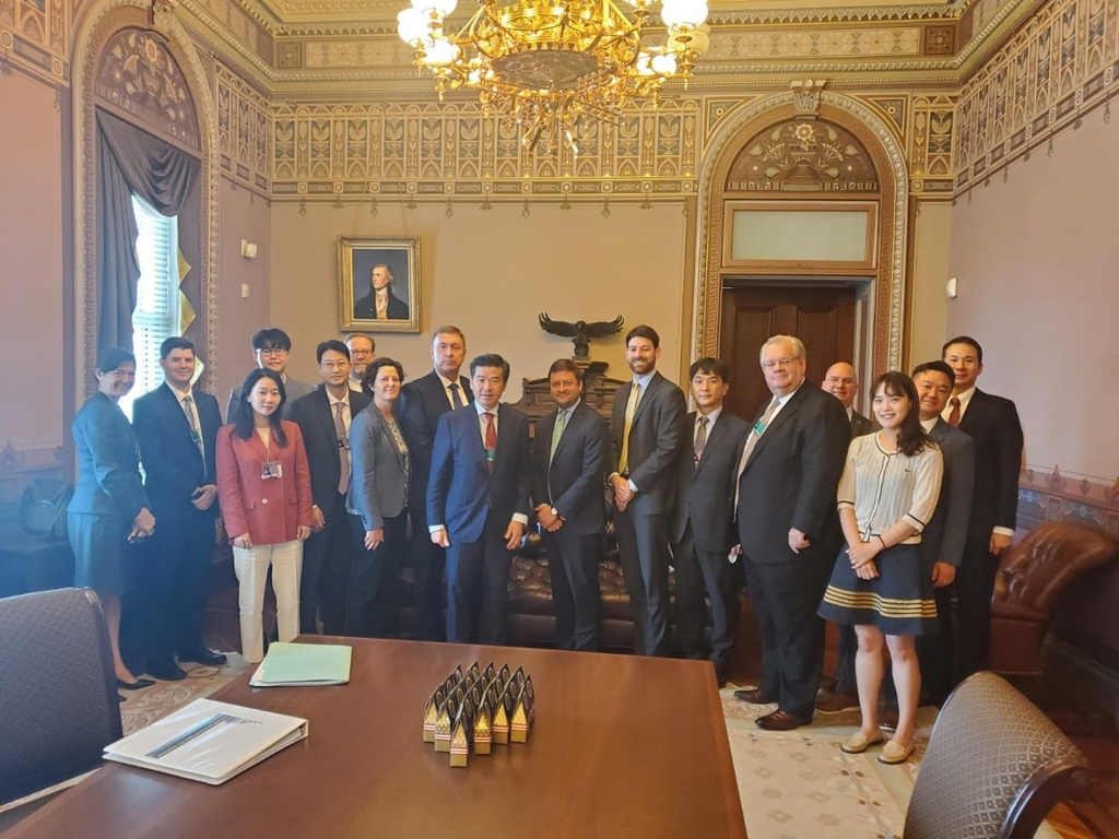 An AMCHAM delegation poses for a photo at the White House on July 29, 2022, after meeting with officials of President Joe Biden's administration, in this photo provided by AMCHAM. (AMCHAM)