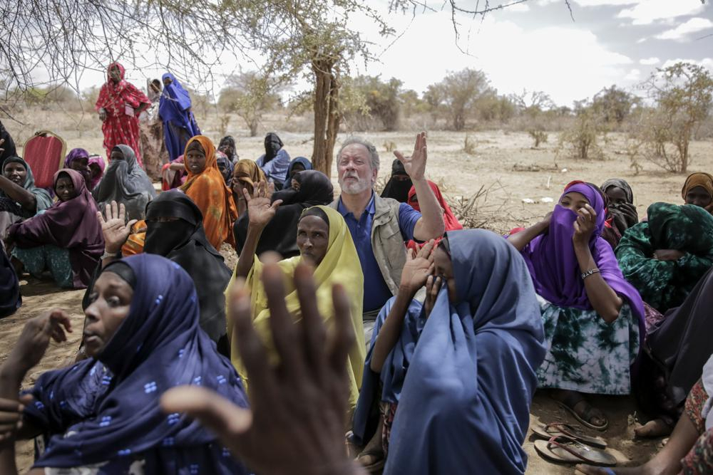 World Food Program chief David Beasley meets with villagers in the village of Wagalla in northern Kenya on Friday. The United States is stepping up to buy about 150,000 metric tons of grain from Ukraine in the next few weeks for an upcoming shipment of food aid from ports no longer blockaded by war, the World Food Program chief has told The Associated Press. (AP Photo/Brian Inganga)