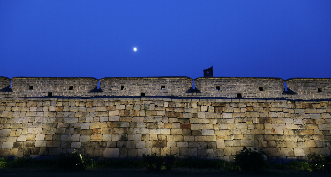 The moon rises over the Suwon Hwaseong Fortress in Suwon, Gyeonggi Province.Photo © Hyungwon Kang