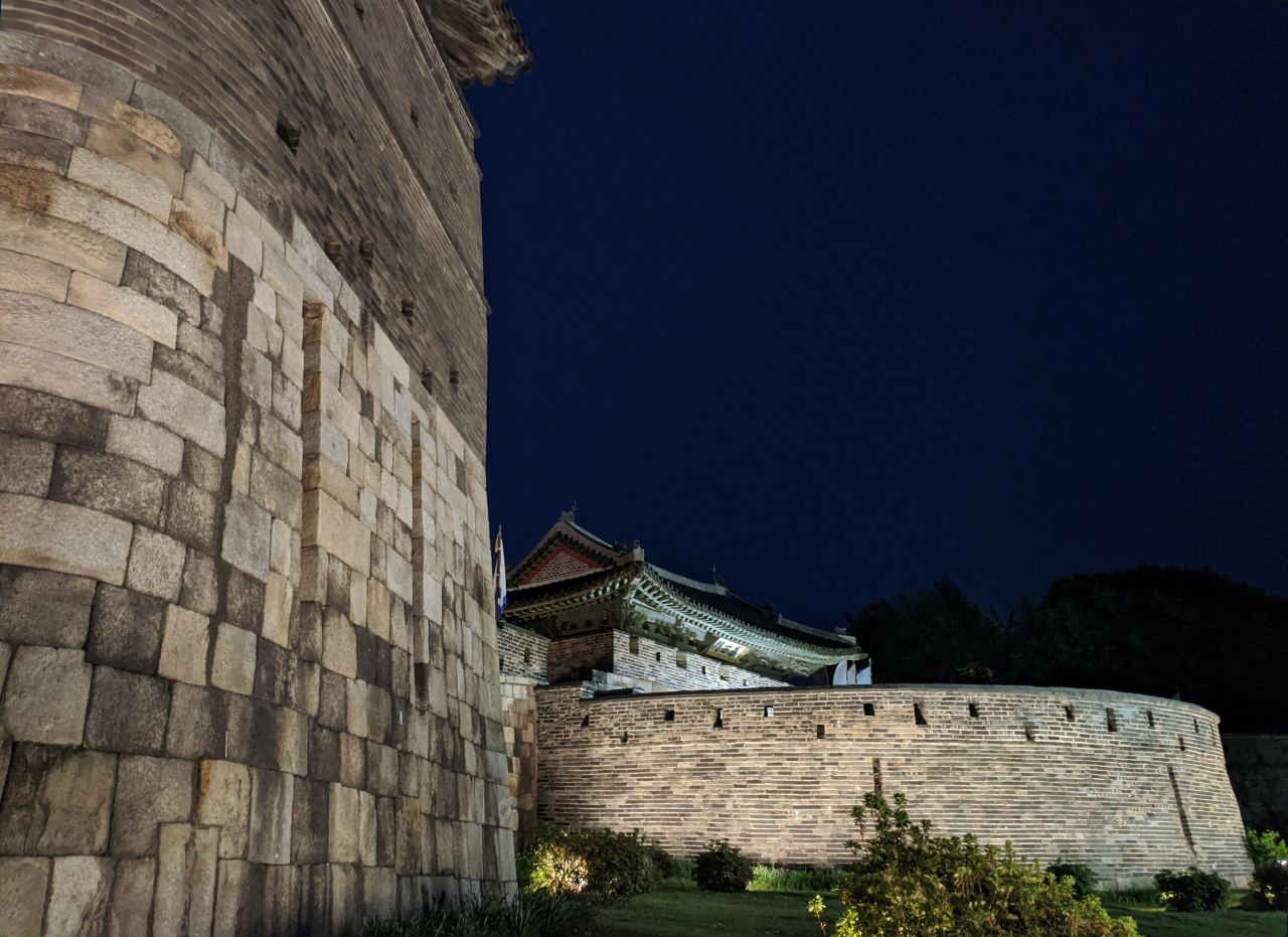 Precise stonework of the granite stone wall and brickwork with openings for weapon fire are seen at the Northwest Gongsimdon, northwestern watchtower (left) and Hwaseomun, the west gate of the Suwon Hwaseong Fortress, in Suwon, Gyeonggi Province.