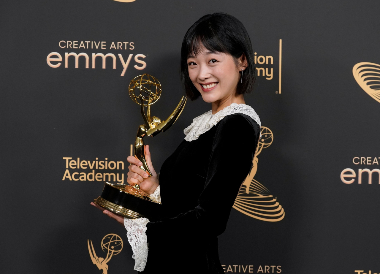 Lee You-mi poses for photos after winning an Emmy Award at Microsoft Theater in Los Angeles, Sunday. (Television Academy)